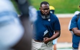 New Chisholm Trail coach Marvin Nash on the field before a Rice football game.