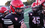 The Eden Prairie football team huddles up before a Minnesota high school football game.