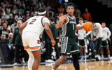 Michigan State guard Jeremy Fears Jr. (1) dribbles against Auburn guard Denver Jones (2) during the first half of the Elite Eight round of NCAA tournament at State Farm Arena in Atlanta. - Junfu Han, USA TODAY Sports
