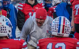A Cherry Creek assistant coach implores the Bruins' offense against Columbine during a Colorado high school football game.