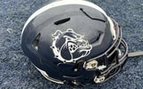 The helmet of a Portland Bulldogs player sits on the field before a Maine high school football game.