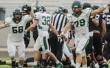 The Eagle Mustangs celebrate a defensive stop in an Idaho high school football game.