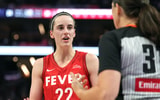 Indiana Fever guard Caitlin Clark talks with a refere