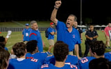 John Curtis Patriots head coach John T. Curtis, Jr. celebrates with his players.
