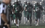 Dutch Fork players enter the field before a South Carolina high school football game.