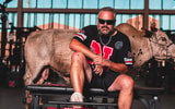 Nebraska and head coach Matt Rhule utilized a real bull for a photoshoot during an official visit weekend in June