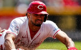Apr 7, 2024; Cincinnati, Ohio, USA; Cincinnati Reds center fielder Bubba Thompson (12) steals third base in the third inning against the New York Mets at Great American Ball Park. Mandatory Credit: Katie Stratman-Imagn Images