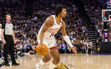 Apr 13, 2025; Sacramento, California, USA; Phoenix Suns guard TyTy Washington Jr. (14) dribbles against the Sacramento Kings during the fourth quarter at Golden 1 Center. Mandatory Credit: John Hefti-Imagn Images