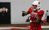 Louisville’s Tayon Holloway (20) catches the ball during Spring Practice on Thursday. April 4, 2024
