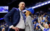 Nov 29, 2024; Lexington, Kentucky, USA; Kentucky Wildcats head coach Mark Pope talks with his wife Lee Anne after the game against the Georgia State Panthers at Rupp Arena at Central Bank Center. Mandatory Credit: Jordan Prather-Imagn Images