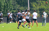 Josiah Trotter (left) and Jackson Daily (right) fight for a ball during a drill