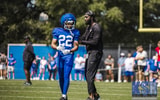 Kentucky WR coach L'Damian Washington coaches up freshman Cameron Miller at Fan Day, via Aaron Perkins, KSR