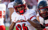 Nov 16, 2024; Stanford, California, USA; Louisville Cardinals running back Duke Watson (26) celebrates his touchdown during the third quarter against the Stanford Cardinal at Stanford Stadium. Mandatory Credit: Bob Kupbens-Imagn Images