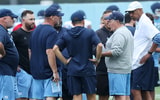 UNC football coach Bill Belichick with assistant coaches on offense.