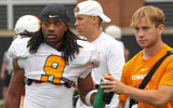 Angelina Alcantar/News Sentinel / USA TODAY NETWORK via Imagn Images | Tennessee running back Star Thomas (9) takes a water bottle from a trainer during Tennessee football preseason practice, in Knoxville, Tennessee, Aug. 6, 2025.