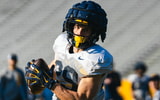 West Virginia wide receiver Preston Fox brings in the catch