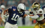 Penn State Nittany Lions running back Nicholas Singleton (10) moves the ball defended by Notre Dame Fighting Irish safety Adon Shuler (8) in the first half in the Orange Bowl at Hard Rock Stadium. (Photo by Sam Navarro-Imagn Images)