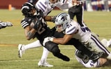 Kansas State Wildcats safety Marques Sigle (21)tackles Iowa State Cyclones running back Abu Sama III (24). (Photo by Reese Strickland-Imagn Images)