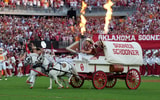 The Sooner Schooner takes the field before a college football game between the University of Oklahoma Sooners (OU) and the Tennessee Volunteers at Gaylord Family - Oklahoma Memorial Stadium in Norman, Okla., Saturday, Sept. 21, 2024. © BRYAN TERRY/THE OKLAHOMAN / USA TODAY NETWORK via Imagn Images
