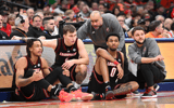 Jan 14, 2025; Syracuse, New York, USA; Louisville Cardinals assistant coaches Brian Kloman (standing) and Mike Cassidy give instructions to forward Khani Rooths (9) and guard Reyne Smith (6) and forward James Scott (0) before entering the game in the second half against the Syracuse Orange at the JMA Wireless Dome. Mandatory Credit: Mark Konezny-Imagn Images