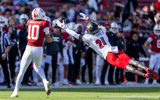 Nov 16, 2024; Stanford, California, USA; Louisville Cardinals defensive back D'Angelo Hutchinson (21) attempts to deflect a pass to Stanford Cardinal wide receiver Emmett Mosley V (10) during the first quarter at Stanford Stadium. Mandatory Credit: Bob Kupbens-Imagn Images