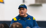 West Virginia head coach Rich Rodriguez addresses his team