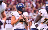 Sep 14, 2024; Starkville, Mississippi, USA; Toledo Rockets quarterback Tucker Gleason (4) looks to pass against the Mississippi State Bulldogs during the first quarter at Davis Wade Stadium at Scott Field. Mandatory Credit: Matt Bush-Imagn Images