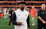 Rich Barnes-USA TODAY Sports | Aug 31, 2024; Syracuse, New York, USA; Syracuse Orange head coach Fran Brown walks on the field after a game against the Ohio Bobcats at the JMA Wireless Dome.