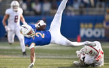 Nov 29, 2024; San Jose, California, USA; San Jose State Spartans wide receiver TreyShun Hurry (2) gets tripped up by Stanford Cardinal safety Scotty Edwards (21) in the second quarter at CEFCU Stadium. Mandatory Credit: Eakin Howard-Imagn Images