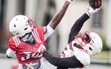 Louisville Cardinals wide receiver Caullin Lacy (5) tries to make a catch under pressure from defensive back Rae'mon Mosby (30) during a recent practice on August 4, 2025 before the start of the 2025 football season.