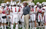 Robert Morris head football coach Bernard Clark Jr. and his team take the field