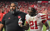 Nebraska football OLB coach Phil Simpson and running back Emmett Johnson walking off the field at halftime of the Huskers' 20-17 win over Cincinnati