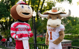 Ohio State mascot, Brutus, and University of Texas mascot, Hook 'Em, interact during a filming of the Joel Klatt Show on Ohio State's campus on Aug. 28, 2025. The Buckeyes' kick off the 2025 season against the Longhorns at Ohio Stadium on Aug. 30. (© Adam Cairns/Columbus Dispatch / USA TODAY NETWORK via Imagn Images)