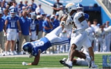 Kentucky TE Josh Kattus takes a tumble against Toledo, Dr. Michael Huang, KSR