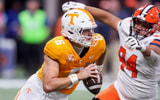 Aug 30, 2025; Atlanta, Georgia, USA; Tennessee Volunteers quarterback Joey Aguilar (6) scrambles past Syracuse Orange defensive lineman Kevin Jobity Jr. (94) in the first quarter at Mercedes-Benz Stadium. Mandatory Credit: Brett Davis-Imagn Images