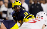 Aug 30, 2025; Ann Arbor, Michigan, USA; Michigan Wolverines quarterback Bryce Underwood (19) gets set to run a play in the first half against the New Mexico Lobos at Michigan Stadium. Mandatory Credit: Rick Osentoski-Imagn Images