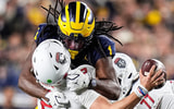Michigan linebacker Jaishawn Barham (1) tackles New Mexico quarterback Jack Layne (2) during the second half at Michigan Stadium in Ann Arbor on Saturday, August 30, 2025. (Junfu Han/Detroit Free Press via USA Today syndication.)