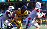 West Virginia defensive lineman Edward Vesterinen closes in on the quarterback