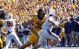 West Virginia linebacker Chase Wilson closes in on the quarterback