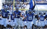 The Kentucky football team arrives at Kroger Field, via Dr. Michael Huang, KSR