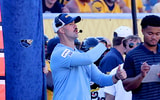 West Virginia defensive coordinator Zac Alley calls the play