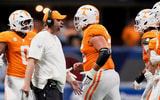 Brianna Paciorka/News Sentinel / USA TODAY NETWORK via Imagn Images | Tennessee head coach Josh Heupel high fives players running off the field during the Aflac Kickoff Game between the Volunteers and Syracuse held at Mercedes-Benz Stadium in Atlanta, Ga., on August 30, 2025.