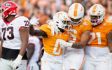 Tennessee defensive back Doneiko Slaughter (0), Tennessee linebacker Aaron Beasley (6) and Tennessee defensive lineman Omari Thomas (21) celebrate during a football game between Tennessee and Georgia at Neyland Stadium in Knoxville, Tenn., on Saturday, Nov. 18, 2023.