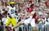 Sep 6, 2025; Norman, Oklahoma, USA; Oklahoma Sooners linebacker Owen Heinecke (38) reacts in front of Michigan Wolverines offensive lineman Greg Crippen (51) during the second half at Gaylord Family-Oklahoma Memorial Stadium. Mandatory Credit: Kevin Jairaj-Imagn Images