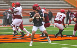 Logan Fife drops back to pass in practice