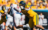 West Virginia defensive linman Devin Grant makes the tackle against Robert Morris