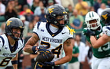 West Virginia wide receiver Rodney Gallagher with the carry