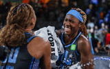 Sep 8, 2025; College Park, Georgia, USA; Atlanta Dream forward Naz Hillmon (0) and guard Rhyne Howard (10) laugh together after the victory against the Connecticut Sun at Gateway Center Arena at College Park. Mandatory Credit: Jordan Godfree-Imagn Images