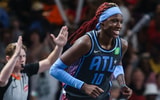 Sep 5, 2025; College Park, Georgia, USA; Atlanta Dream guard Rhyne Howard (10) smiles after shooting a three point shot against the Los Angeles Sparks during the first quarter at Gateway Center Arena at College Park. Mandatory Credit: Jordan Godfree-Imagn Images