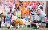 Angelina Alcantar/News Sentinel / USA TODAY NETWORK via Imagn Images | Tennessee defensive lineman Bryson Eason (20) jumps onto the ball after Georgia quarterback Gunner Stockton (14) drops the ball during a NCAA football game between Tennessee and Georgia at Neyland Stadium in Knoxville, Tennessee, on September 13, 2025.
